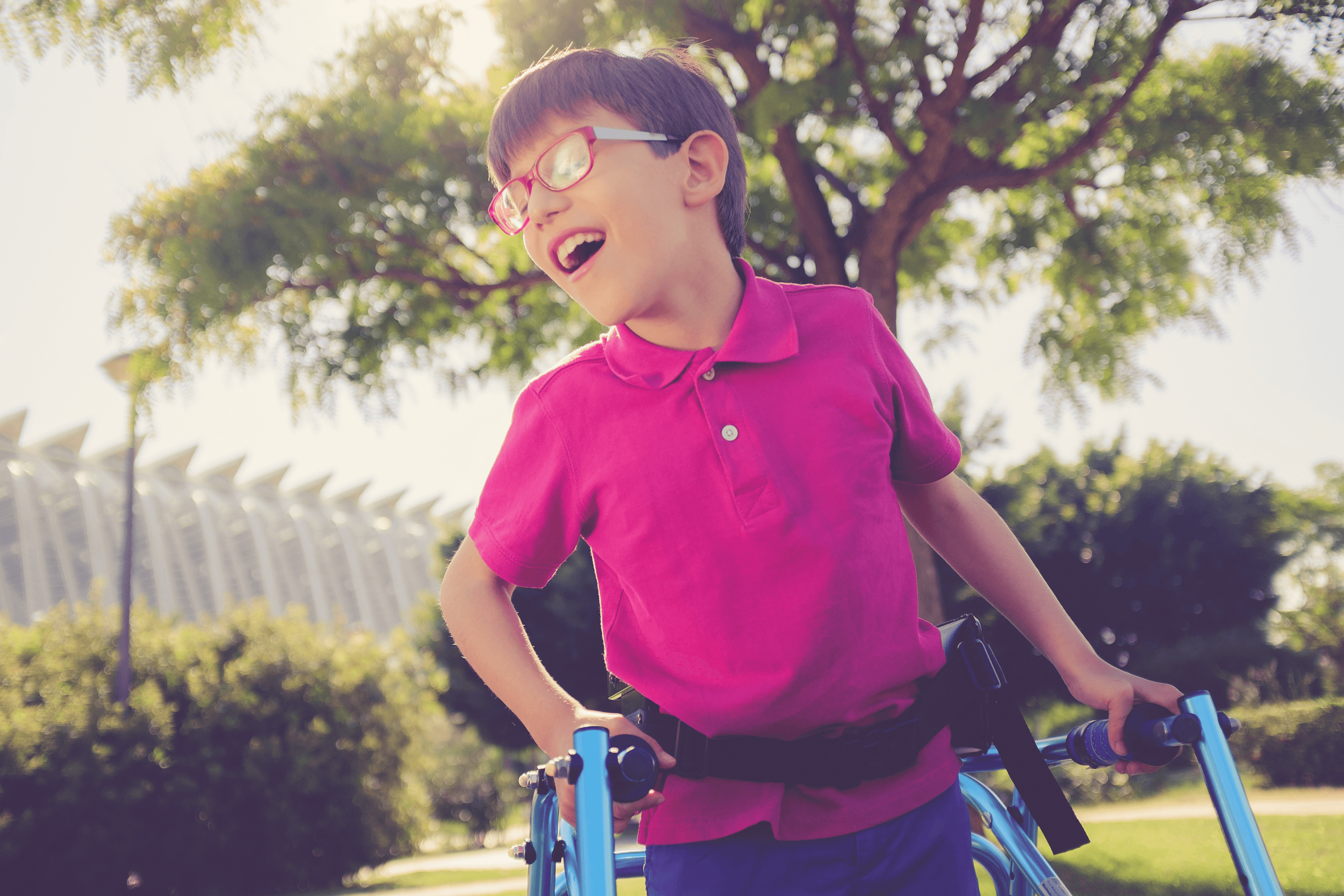 smiling boy with walking aid