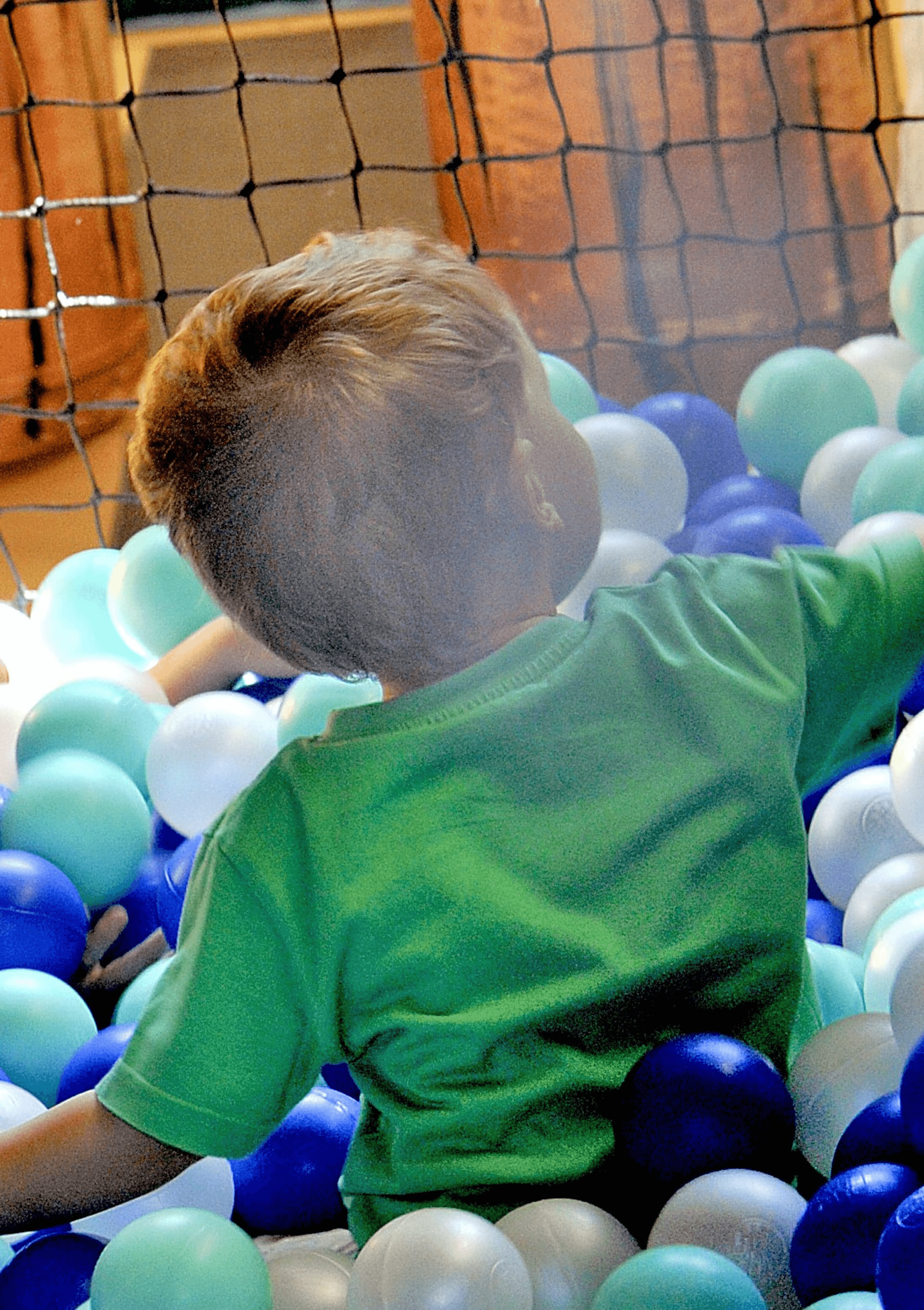 Child in ball pool